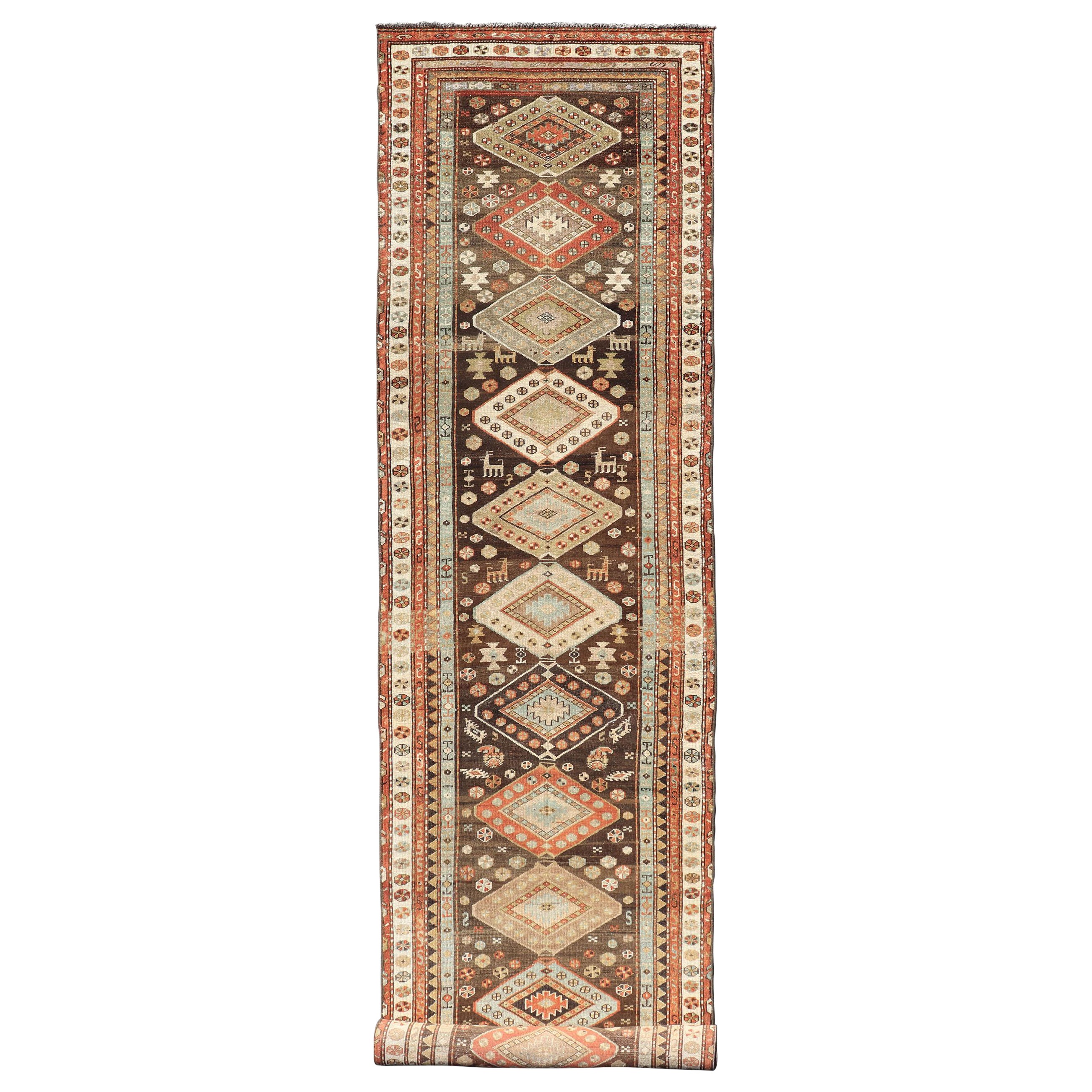 Long Persian Kurdish Runner with Medallion Design in Brown, Orange and Cream For Sale