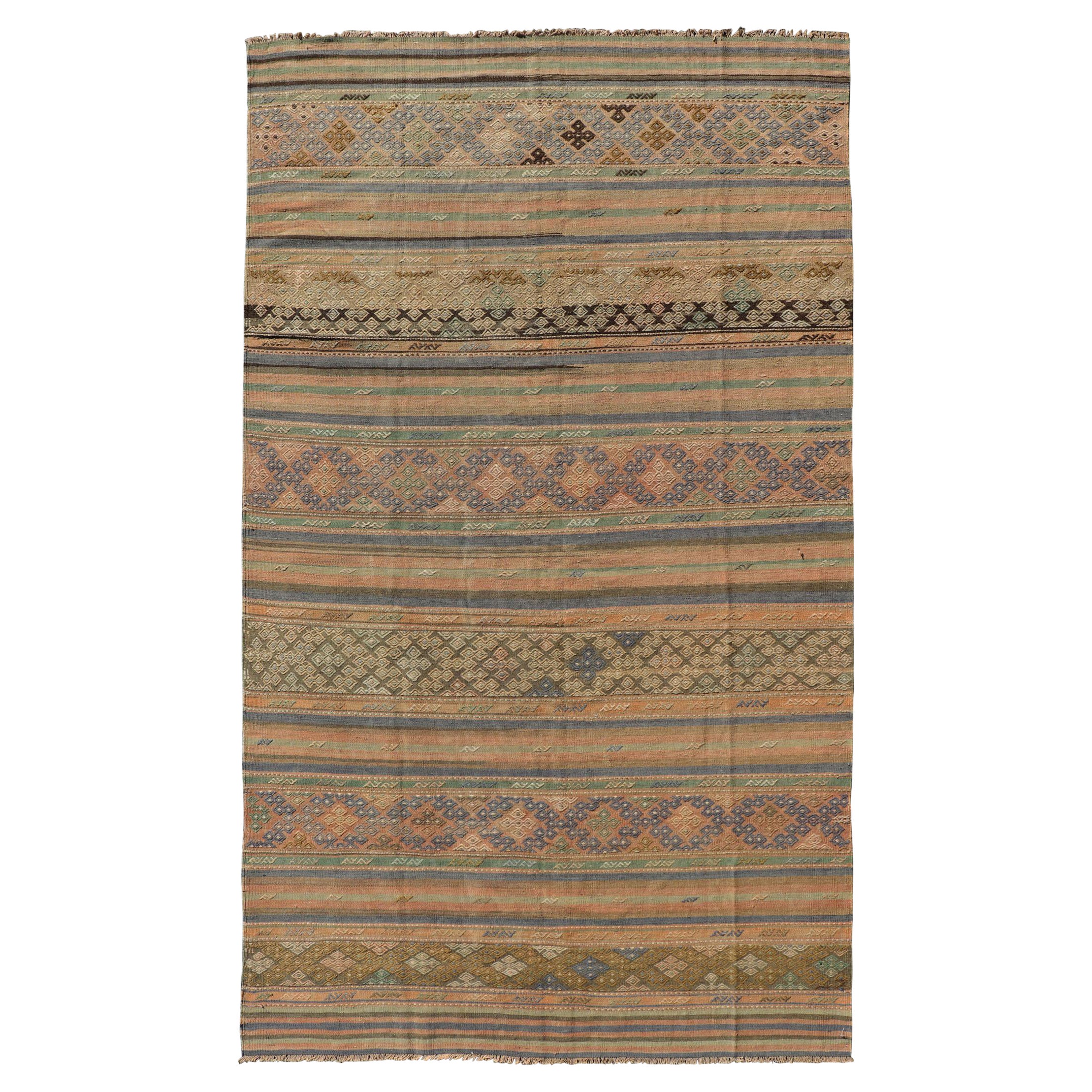 Vintage Striped Turkish Kilim Rug with Geometric Shapes and Soft Muted Colors For Sale