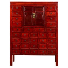Antique Red Lacquered 1930s Apothecary Cabinet with 32 Drawers and Petite Double Doors