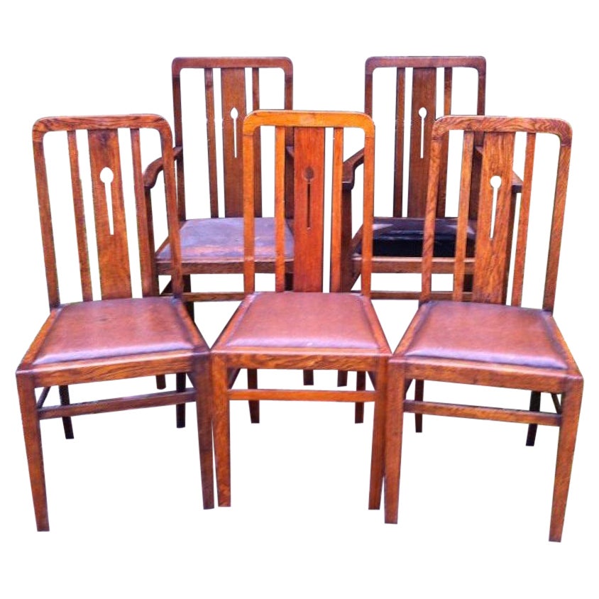 Five English Arts & Crafts Oak Dining Chairs with Simple Stylised Floral Details