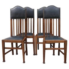 Wylie & Lochhead Attri. a Set of Four English Arts and Crafts Oak Dining Chairs