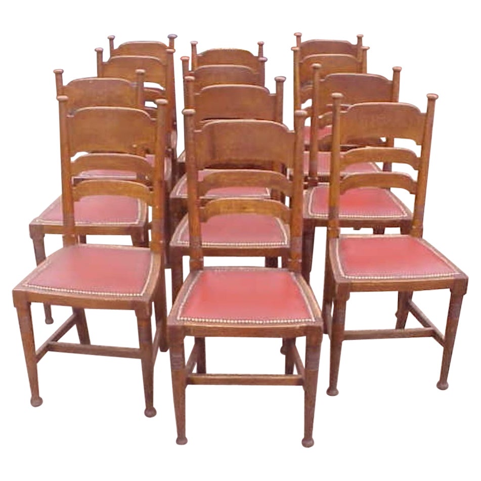 William Birch for Liberty & Co. a Set of Sixteen Arts & Crafts Oak Dining Chairs For Sale