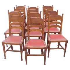 William Birch for Liberty & Co. a Set of Sixteen Arts & Crafts Oak Dining Chairs