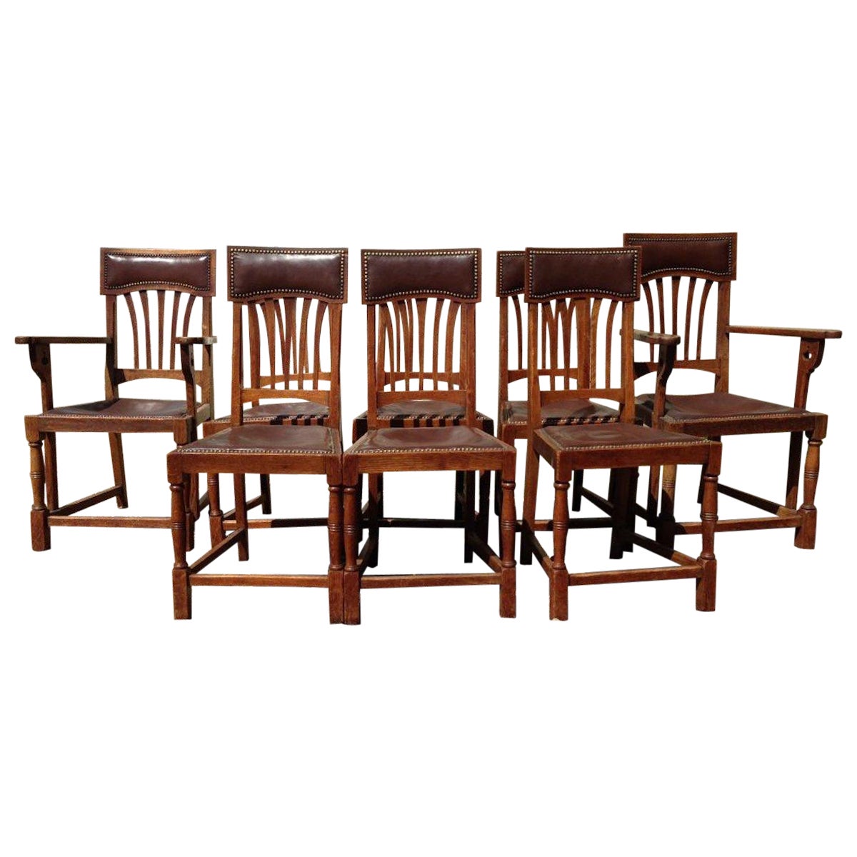 Shapland & Petter Attri a Set of Eight English Arts & Crafts Oak Dining Chairs
