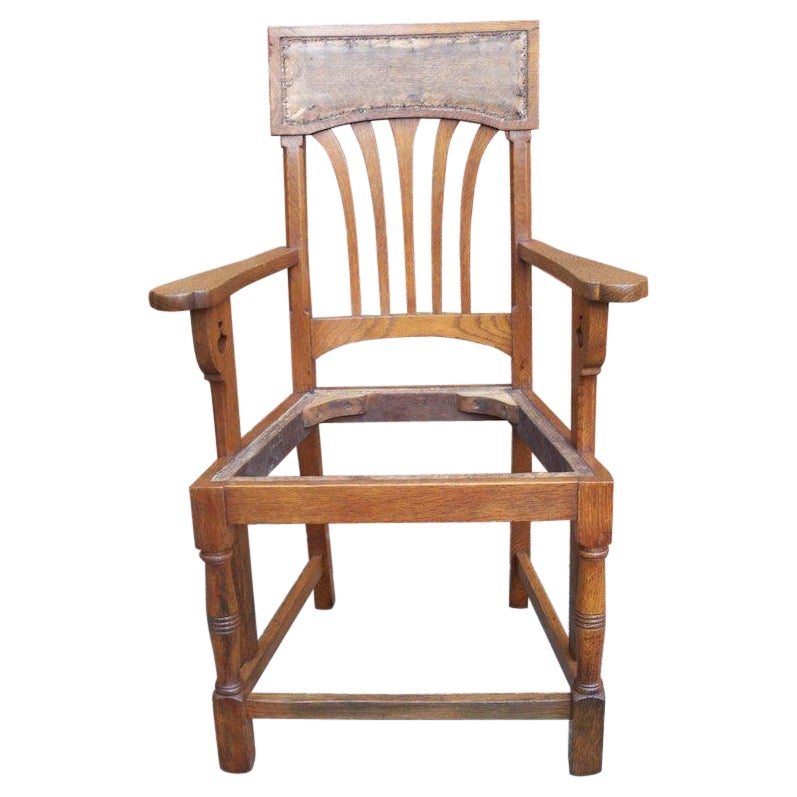 English Arts & Crafts Oak Dining Chair with Stylised Floral Cut-Outs to the Arms For Sale