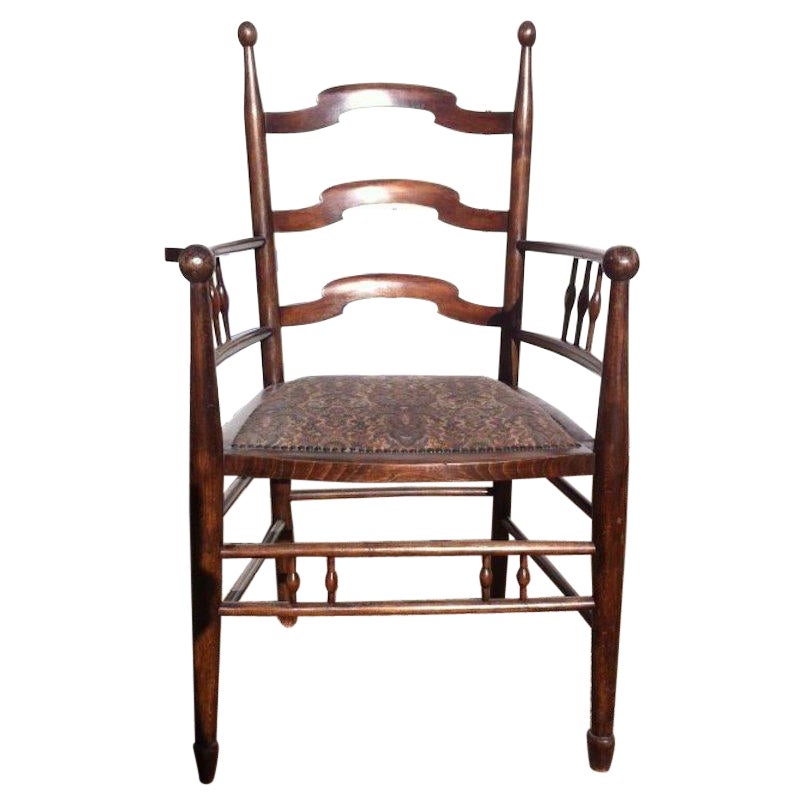 Liberty & Co Attributed, an English Walnut Arts & Crafts Ladder Back Armchair For Sale