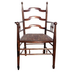 Liberty & Co Attributed, an English Walnut Arts & Crafts Ladder Back Armchair