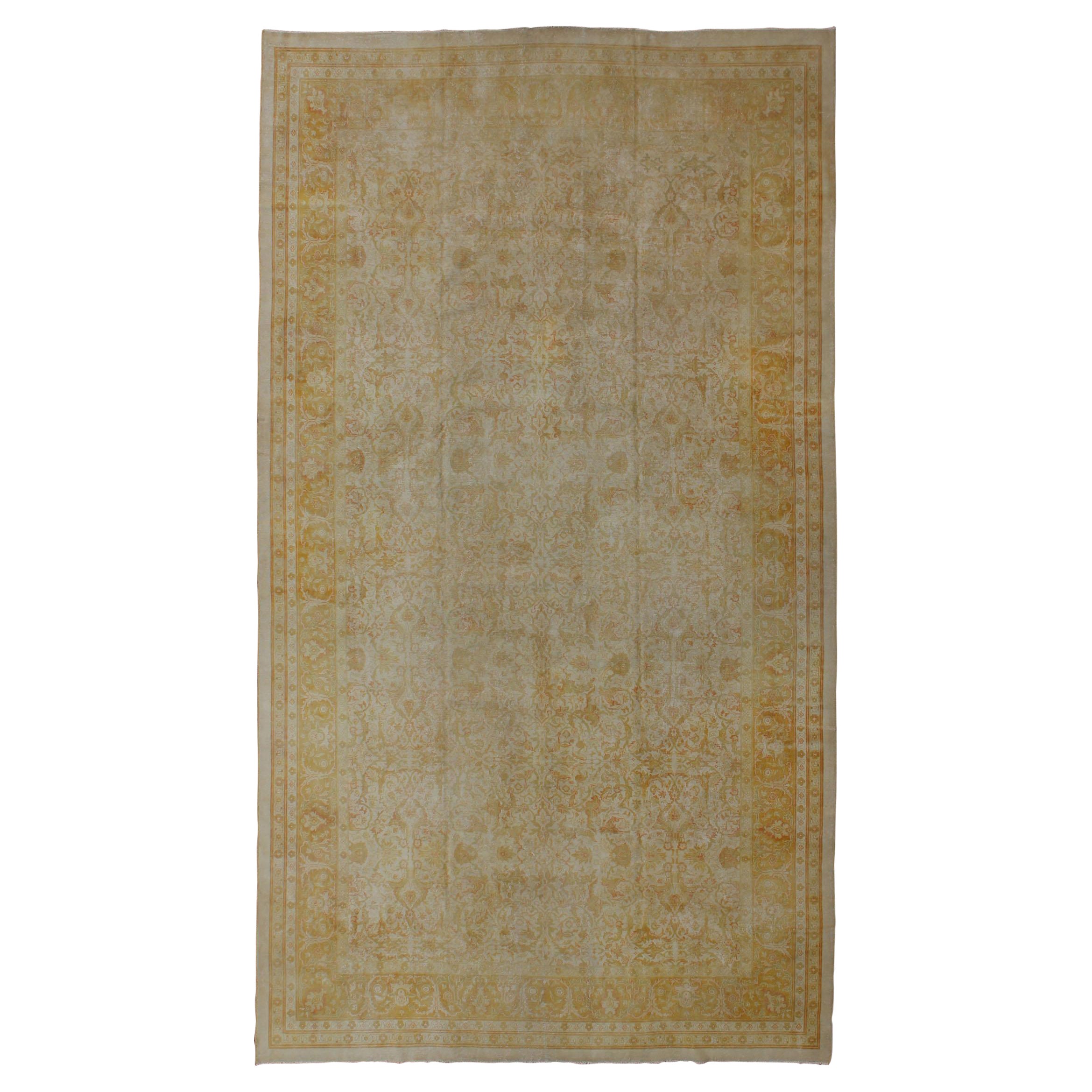 Large All Over Design Distressed Indian Amritsar Rug in Green, Yellow, and Ivory For Sale