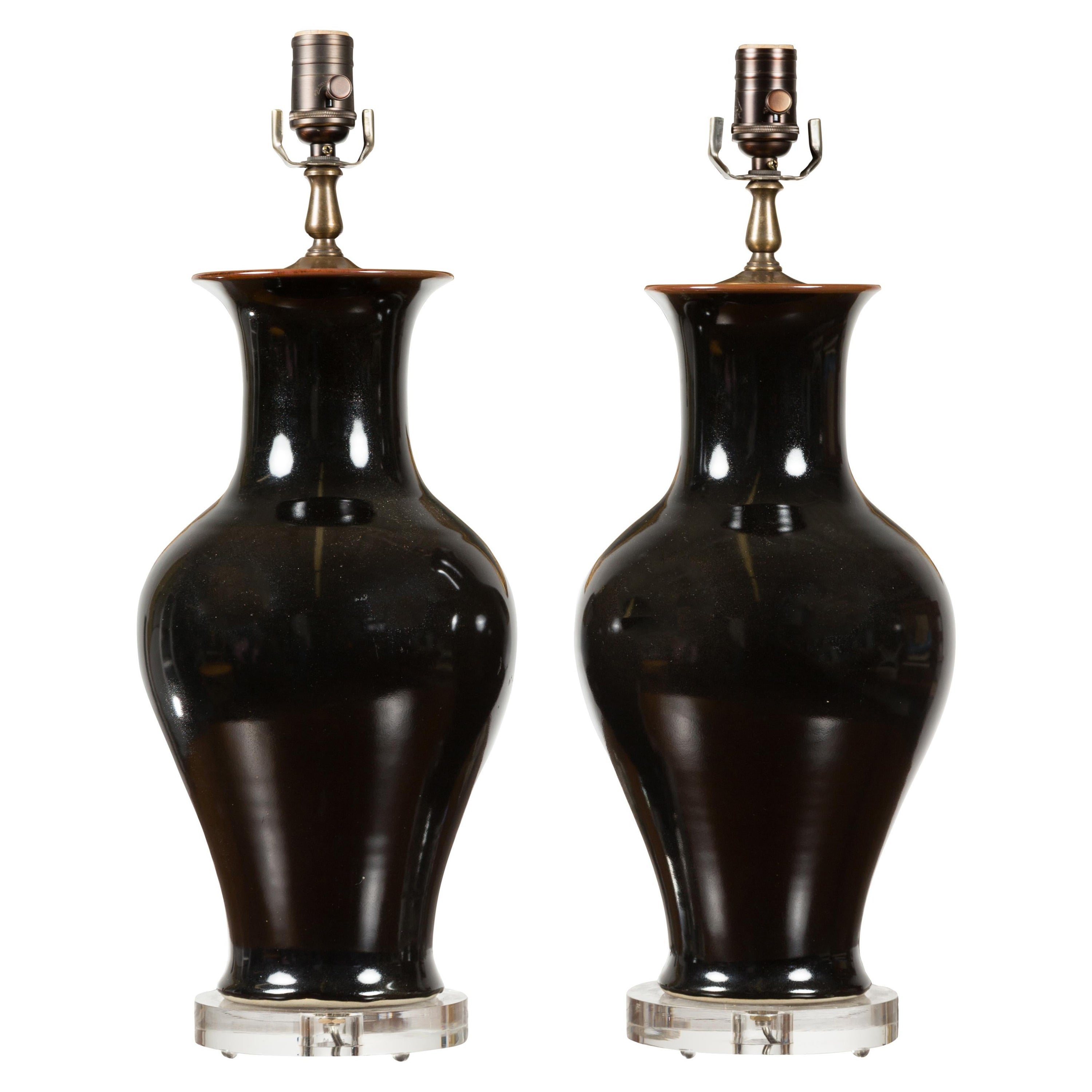 Pair of Black Porcelain Vase Shaped Table Lamps with Round Lucite Bases, Wired For Sale