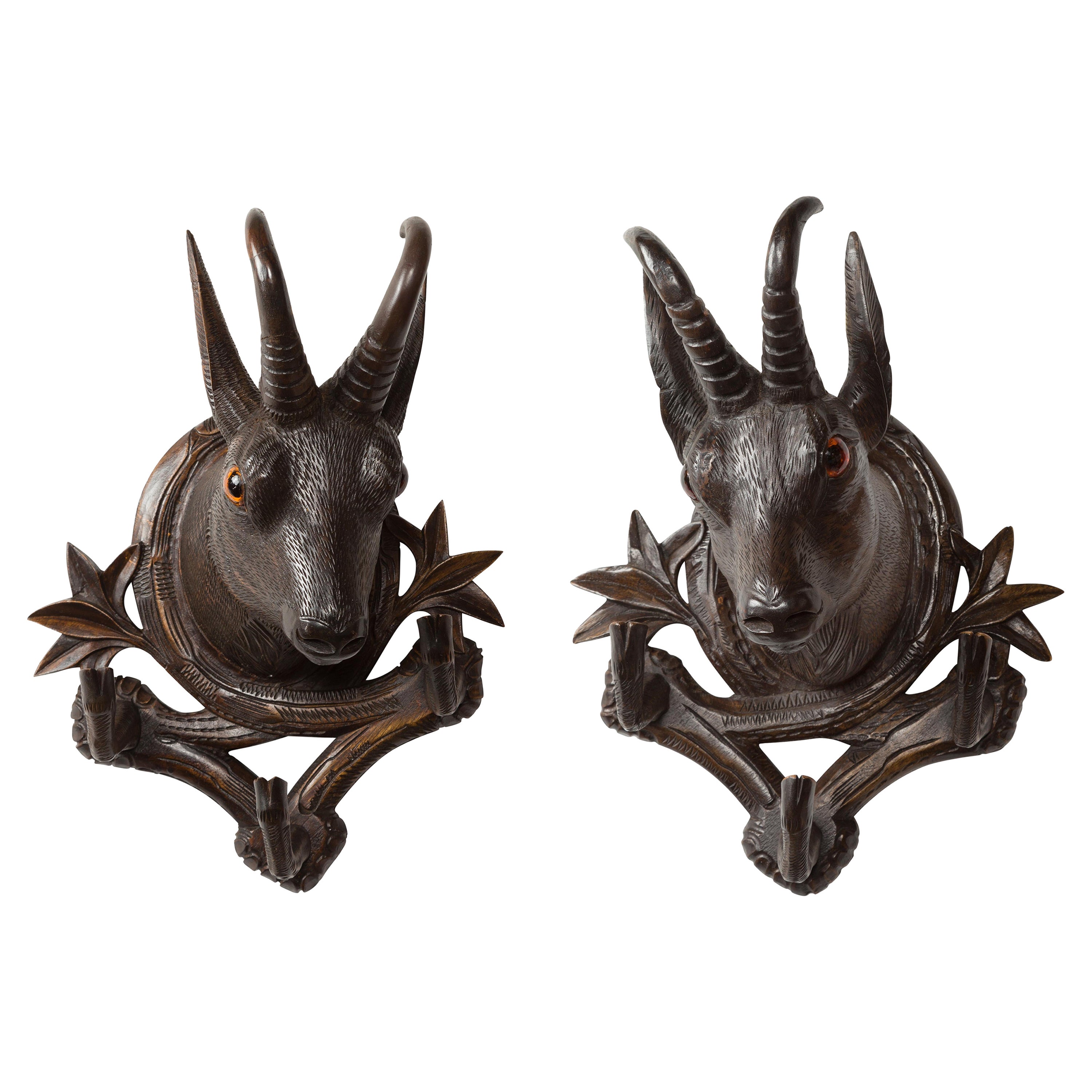 Pair of Black Forest 1880s Carved Wooden Chamois Coat or Hat Racks with Foliage