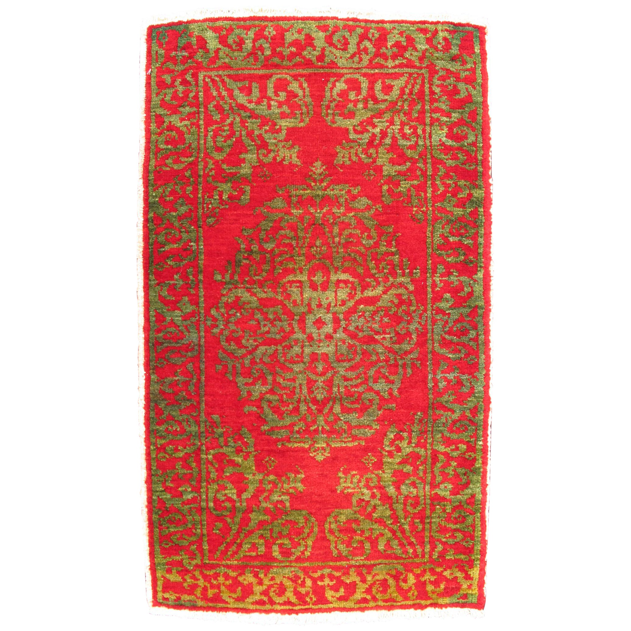 Antiker türkischer Ottomane-Teppich mit Blumenmedaillon in Rot und Grün