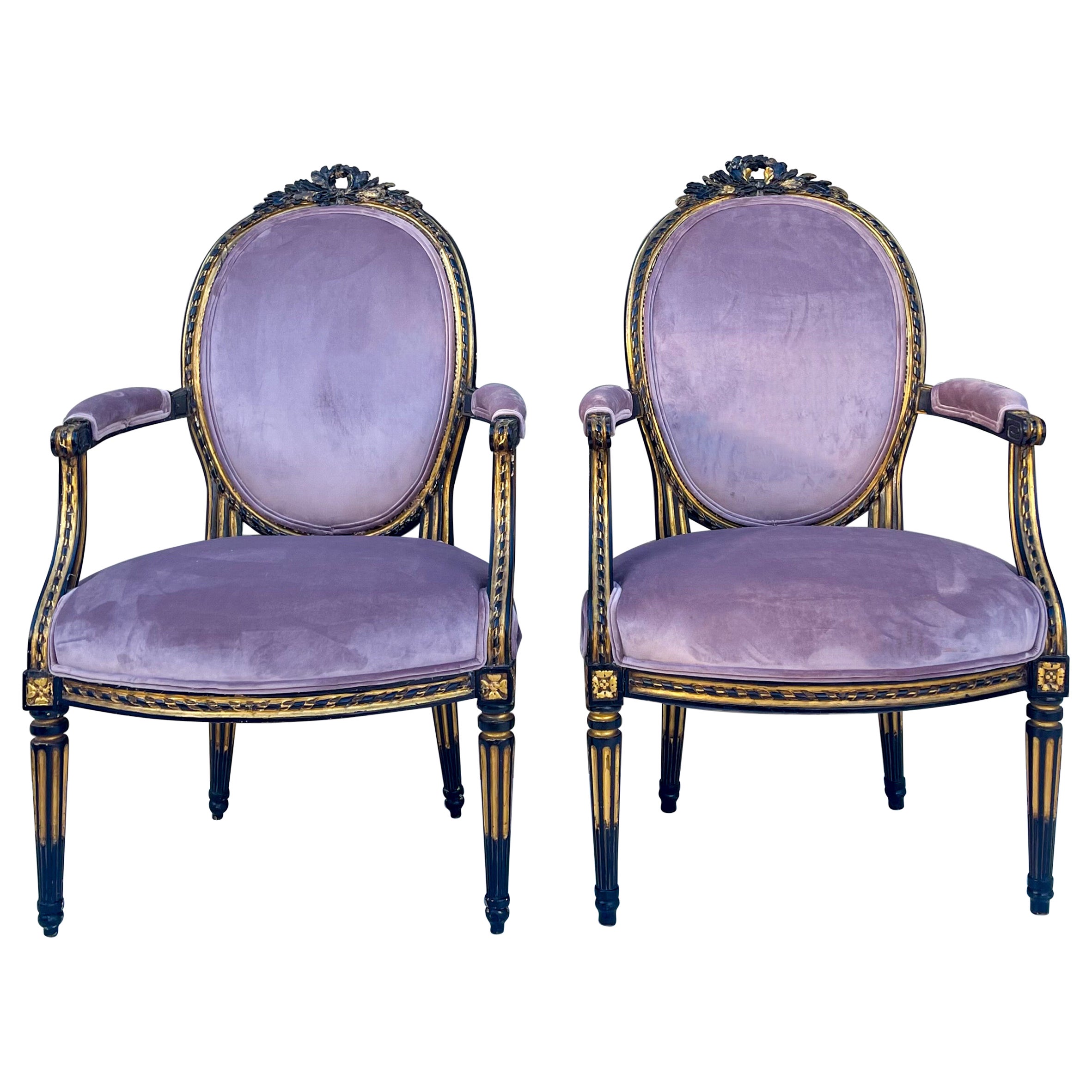 Paire de chaises bergères françaises de style Louis XIV en bois d'ébène et doré à la feuille