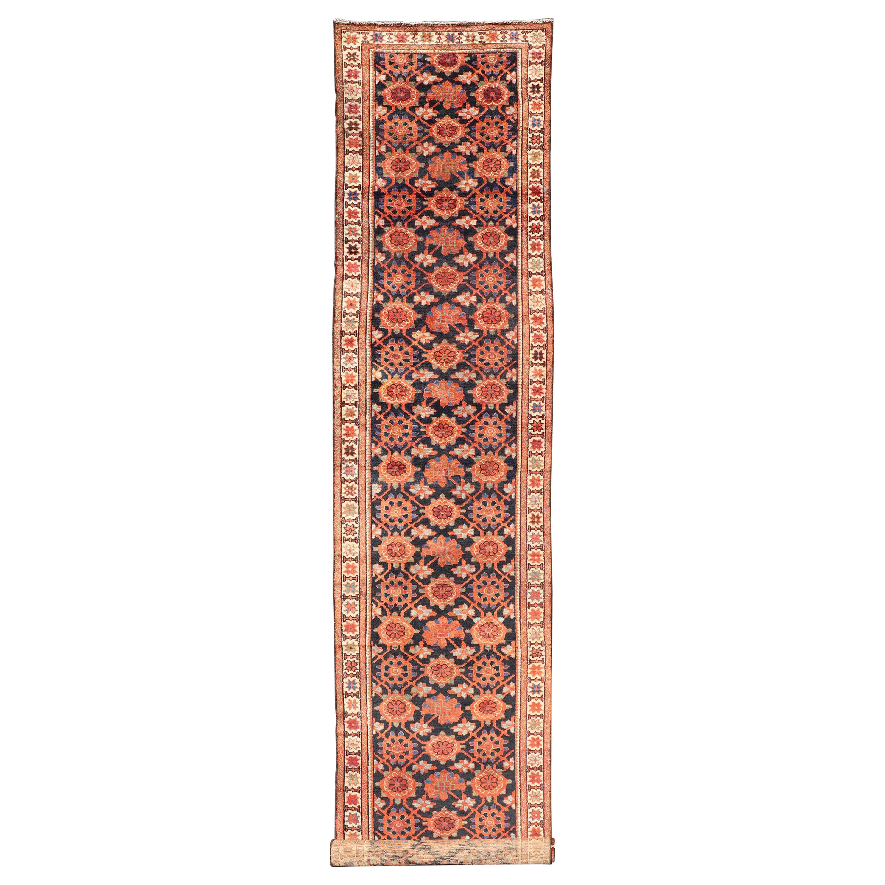Antique Persian Malayer Runner with Reds and Oranges on a Charcoal Background For Sale