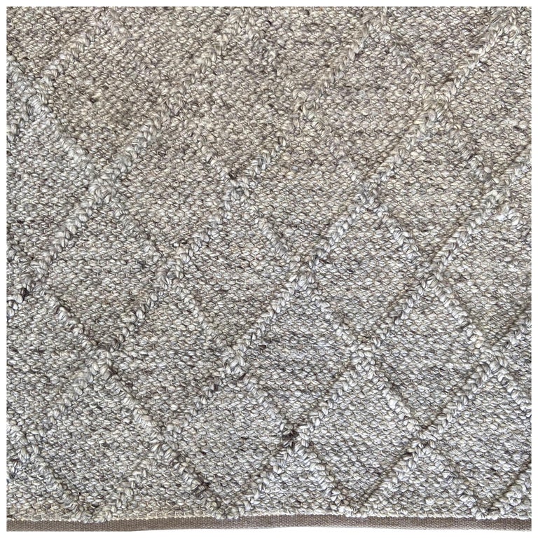 Braided wool rug, new, offered by bloom home inc.