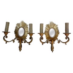 Appliques à soleil en bronze doré attribuées à la Maison Baguès