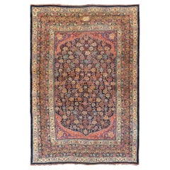 Großer antiker persischer Bidjar-Teppich aus Persien mit farbenfrohen Blumen und marineblauem Feld
