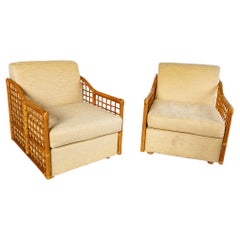 Pair of Mid Century Rattan Arm Chairs/ Fauteuils