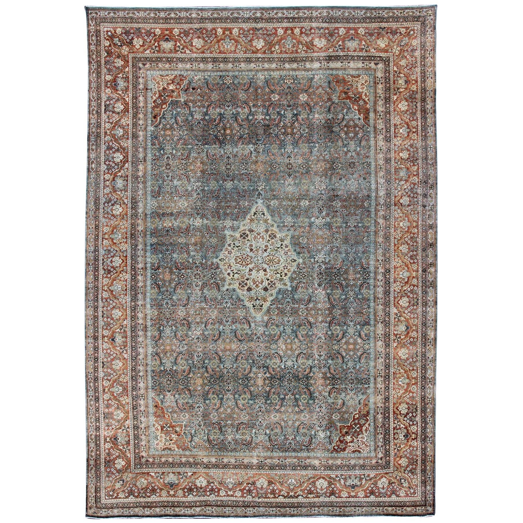 Distressed Antique Persian Sultanabad Rug in Steel Blue Background, Green, Red For Sale