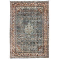 Distressed Antique Persian Sultanabad Rug in Steel Blue Background, Green, Red
