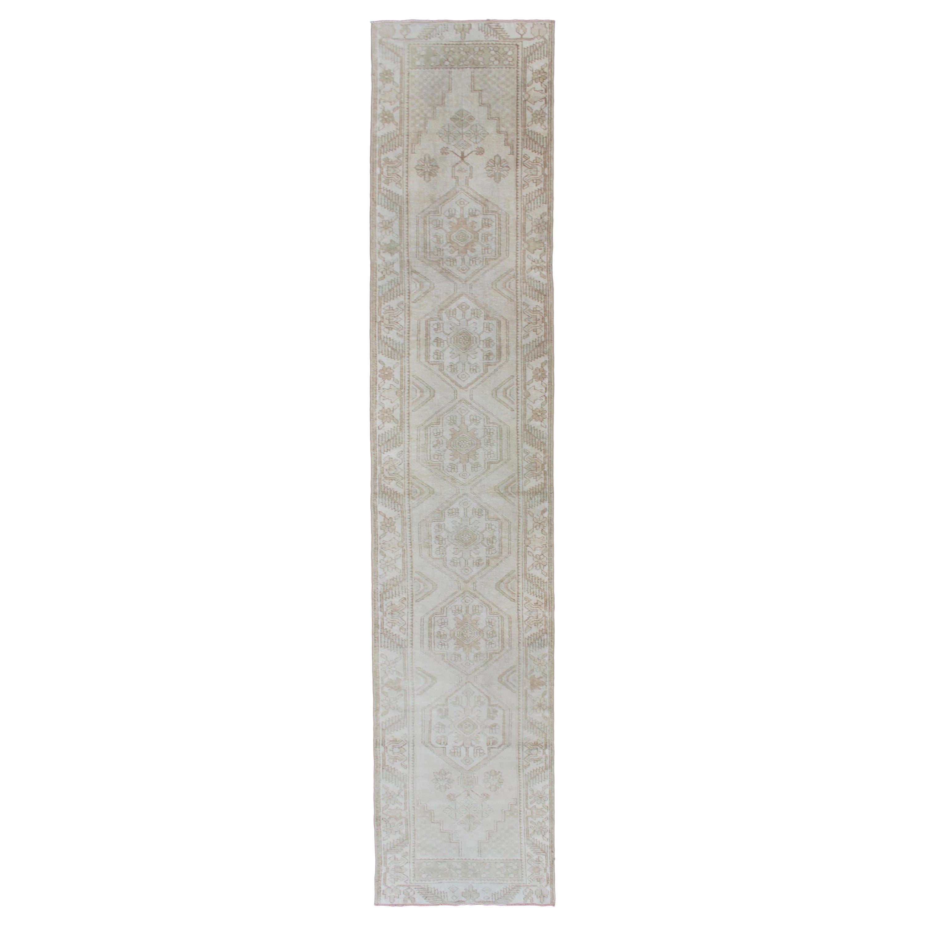 Subdued Vintage Turkish Oushak Runner with Medallions in Soft Cream For Sale
