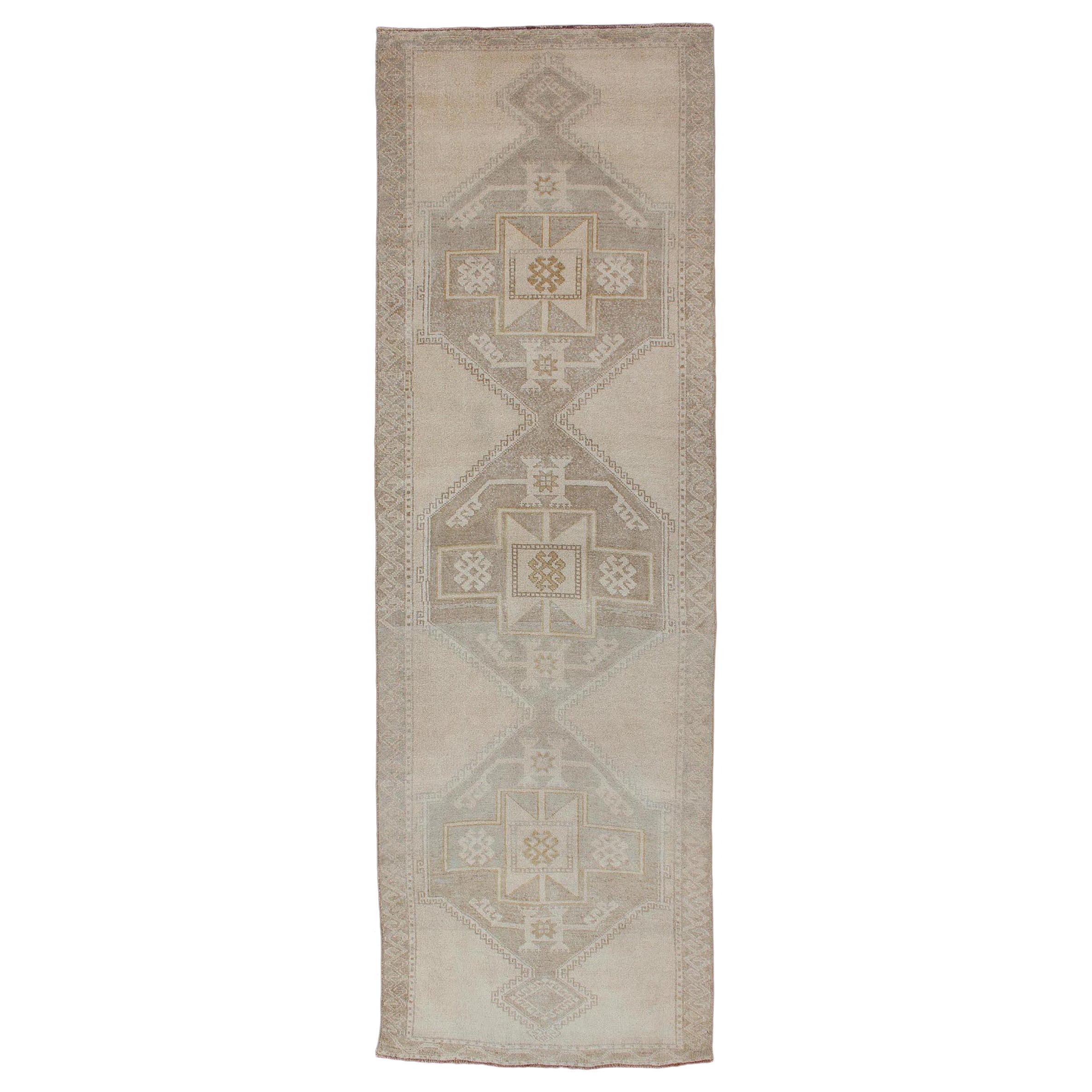 Vintage Turkish Oushak Runner with Etched Medallion Design in Soft Muted Tones For Sale