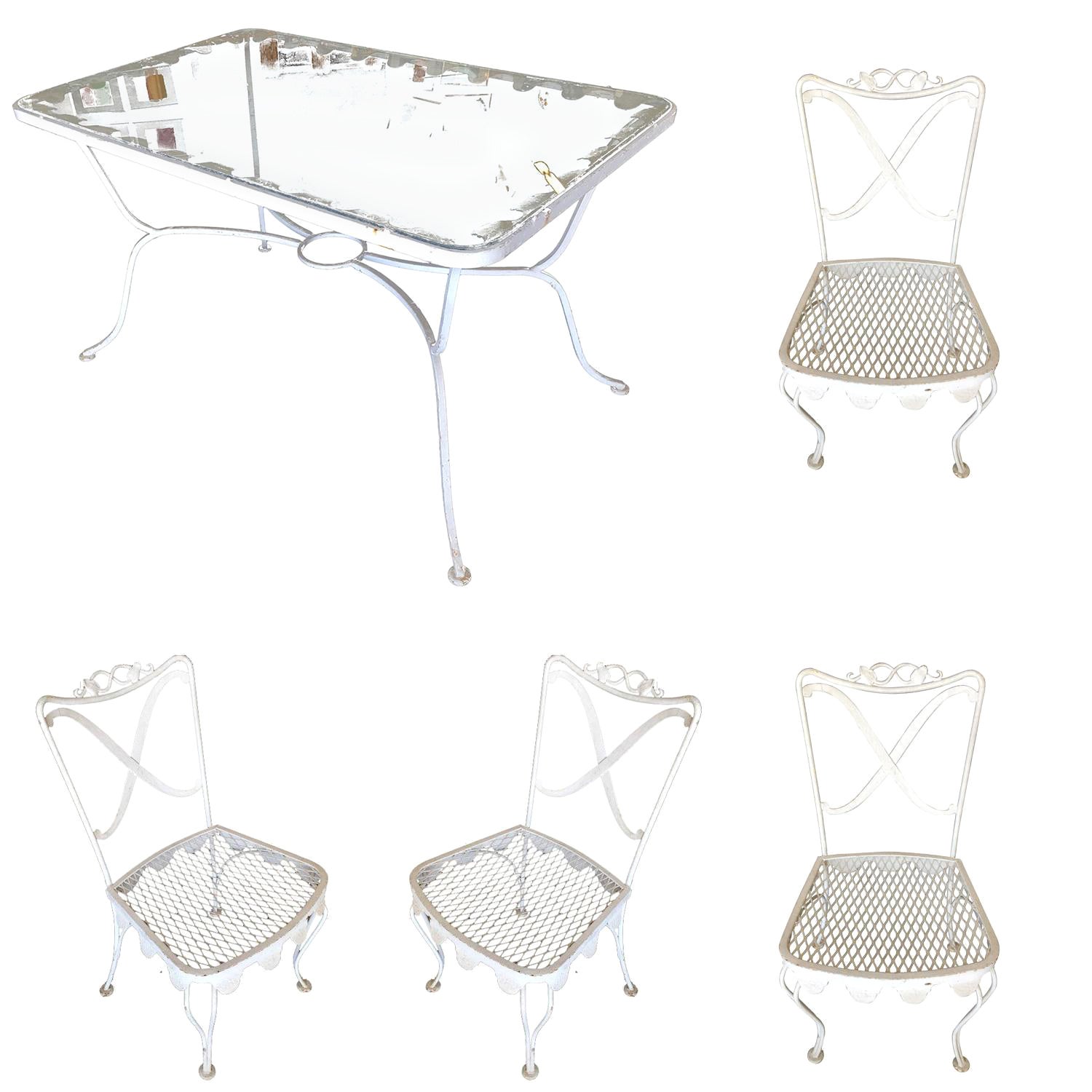 Table et 4 chaises en fer forgé à motifs de volutes pour terrasse de café en vente
