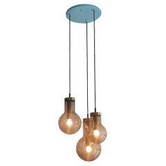 Retro Chandelier of 3 Glass and Brass 'Maxi Globe' Pendant Lamps by RAAK, 1960's