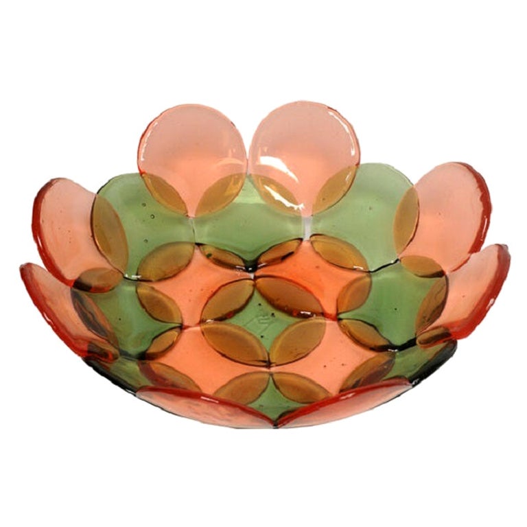 Petit panier en résine en forme de cercle en vert bouteille transparent et rubis clair d'Enzo Mari