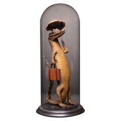 Small Alligator with Umbrella and Travel Case under a Bell Jar