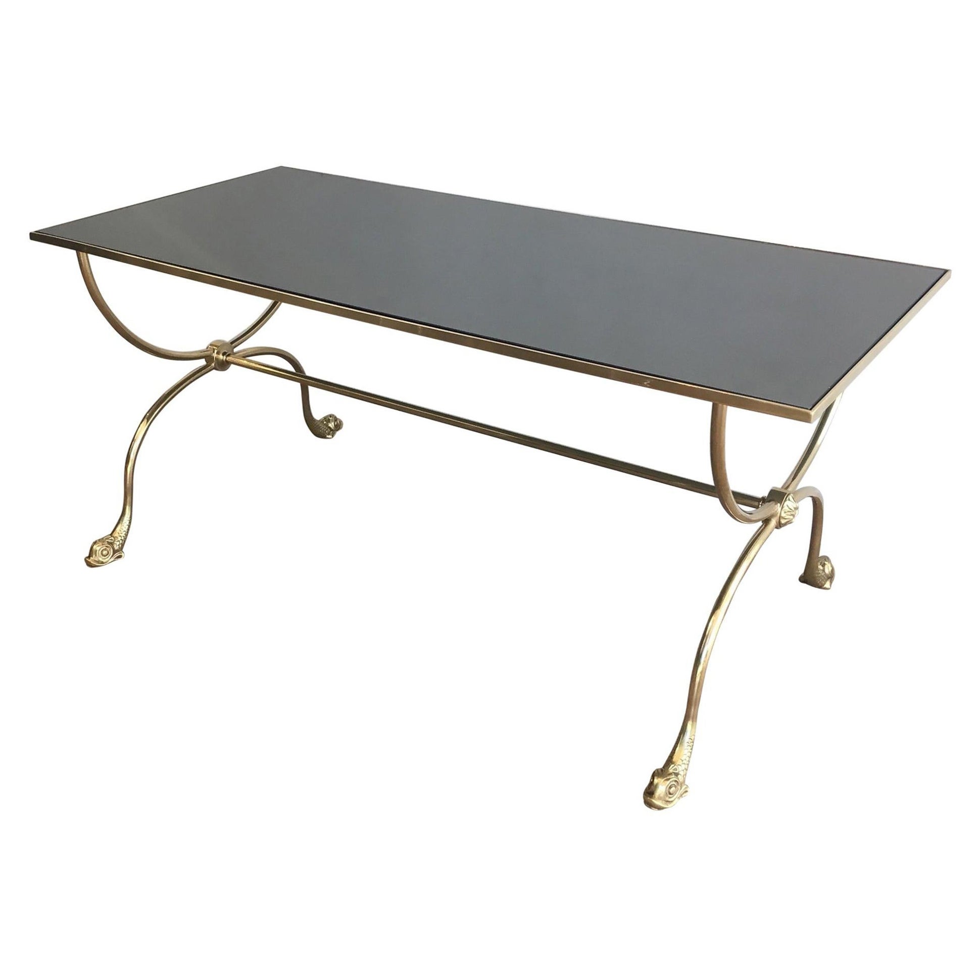 Table basse en laiton de style néoclassique avec têtes de dauphins et plateau en miroir