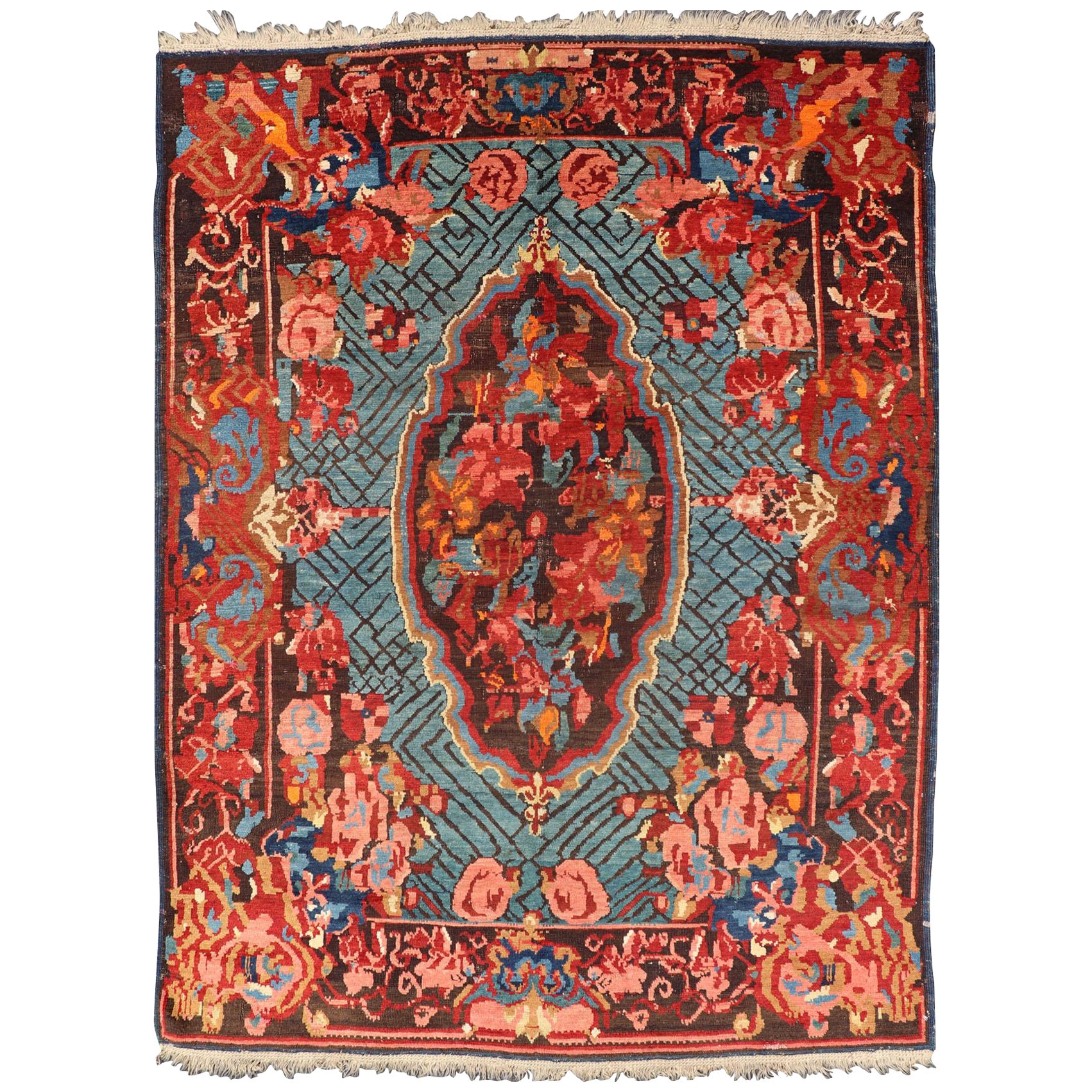 Antique Caucasian Kuba Rug with a Central Floral Medallion For Sale