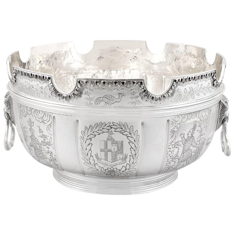 A magnificent, fine and impressive antique Edwardian English sterling silver Monteith bowl; an addition to our range of collectable silverware.

This magnificent antique Edwardian sterling silver bowl has a large Monteith form onto a spreading