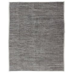 Muted Dark Gray Casual Modern Rug with High and Low Textured Pile