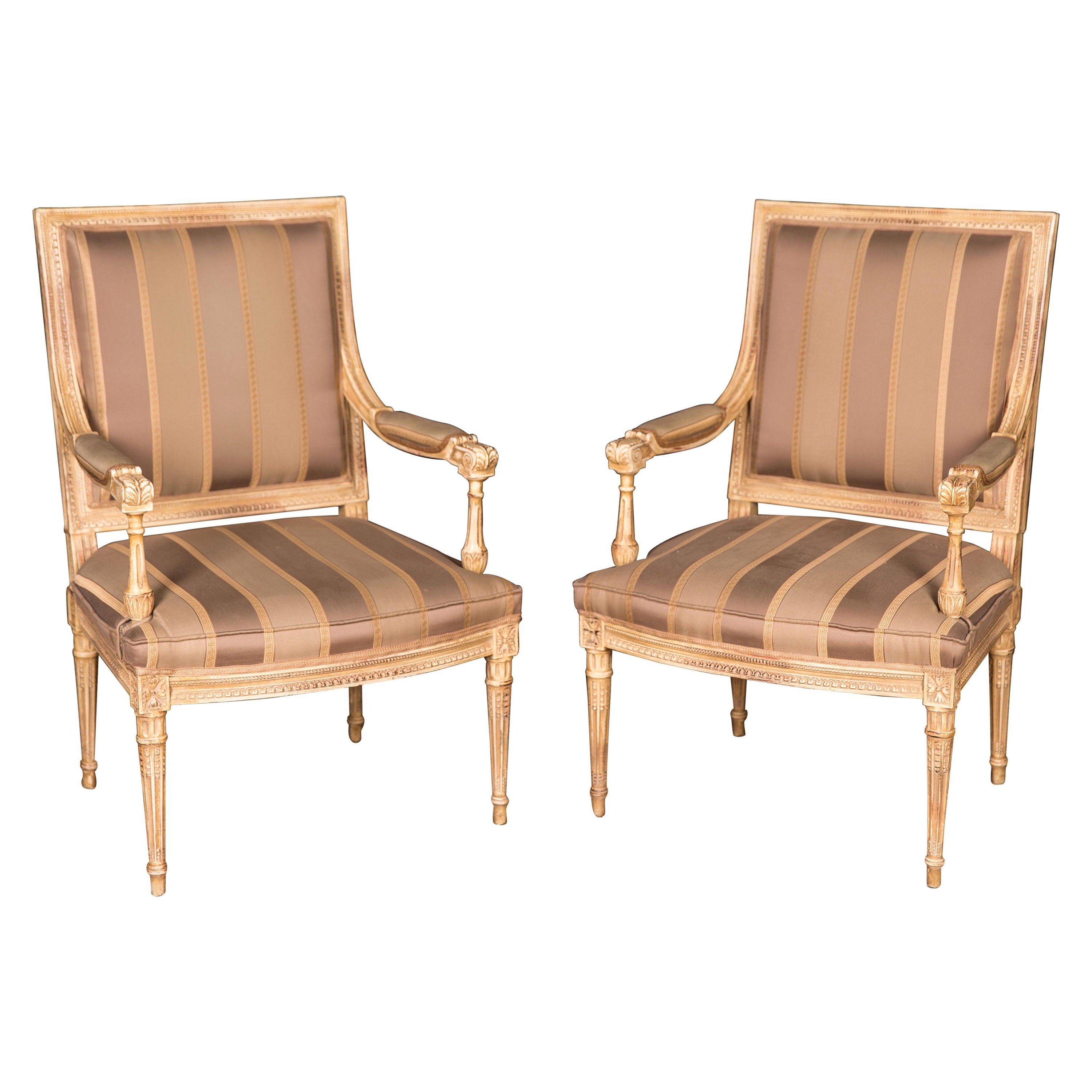 Two Elegant French Armchairs in the antique Louis Seize Style beech hand carved For Sale