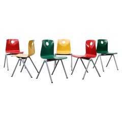 Multi-Colored Stacking Chairs with Circle Cut out