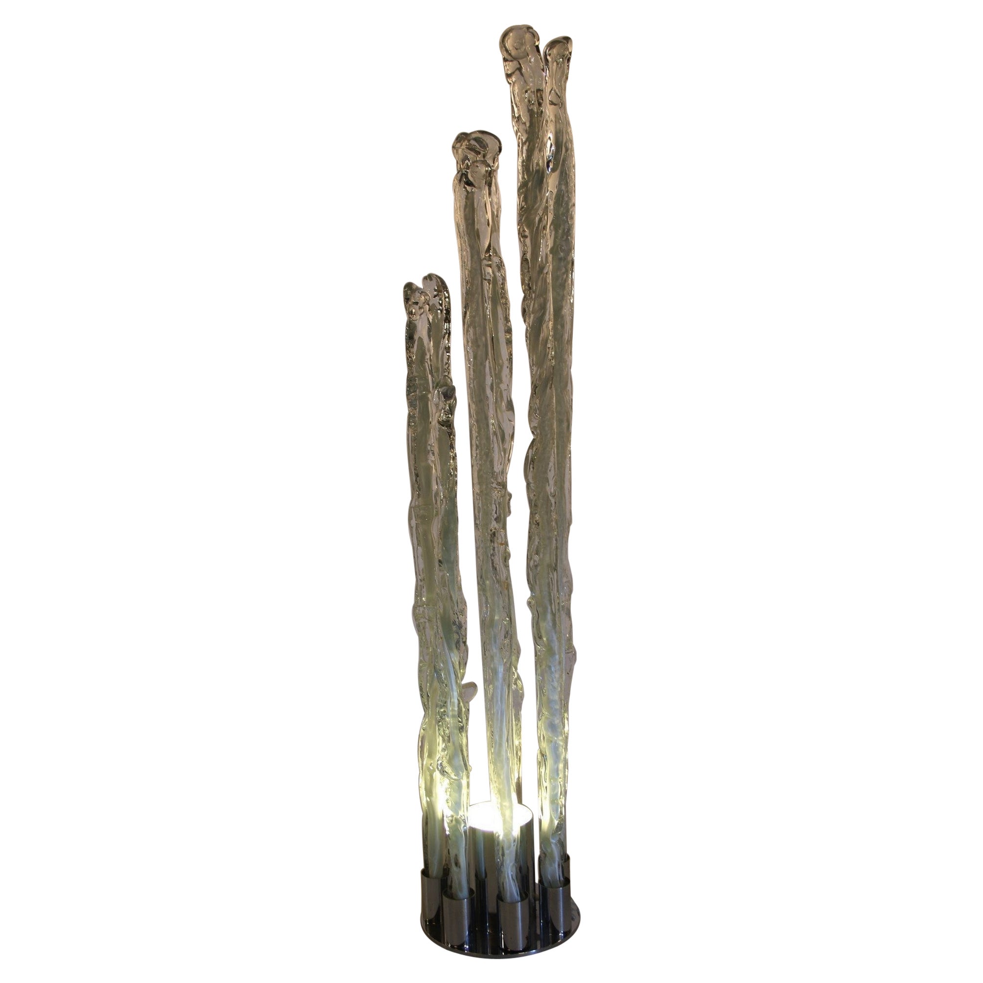 This lamp will be a wonderful statment piece in every interior. Designed by Italian designers Ettore Fantasia and Gino Poli around the 1960s. 

The foot of this beautiful Excalibur Ice floor lamp is made of chrome. The seven ice-like pillars are