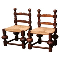 Pair of Early 20th Century French Carved Walnut Low Chairs with Rush Seat