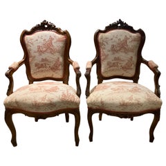 Pair Louis XV-Style Arm Chairs in Walnut with Carved Cartouche Toile Upholstery