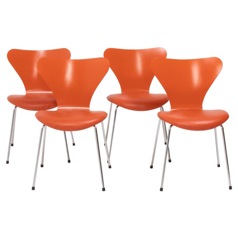 Fritz Hansen by Arne Jacobsen Orange Leather Series 7 Dining Chairs, Set of 4 For Sale