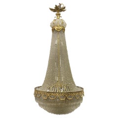 Magnifique lustre à quatorze lumières en cristal perlé de bronze doré de la fin du XIXe siècle