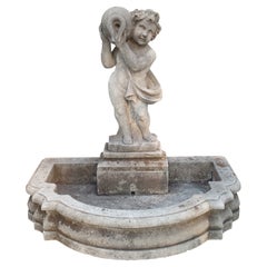 Carved Italian Limestone Putti Fountain with Self Enclosed Basin