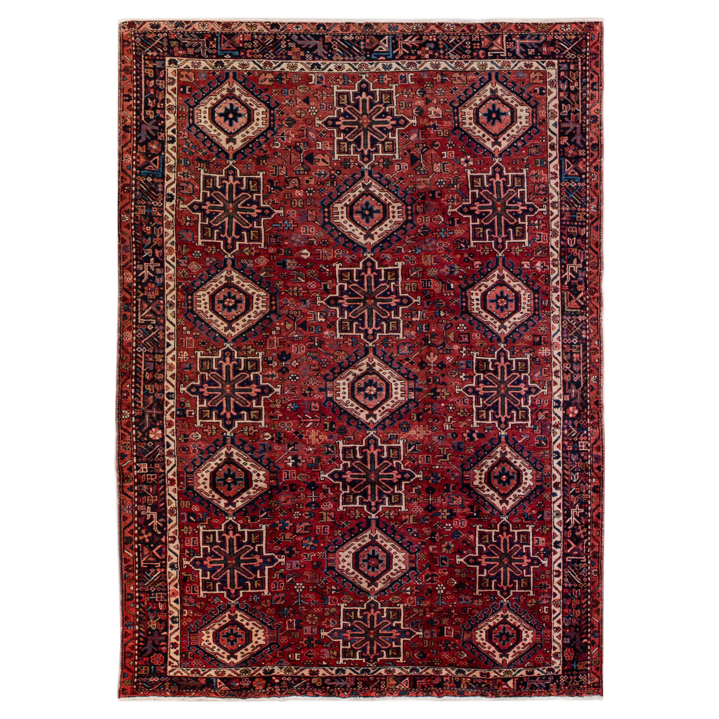 Ancien tapis persan Heriz en laine rouge à motif géométrique fait à la main