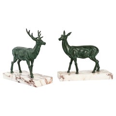 French Pair of Art Déco Bronze Boodends, Green Deers in Motion, 1940s