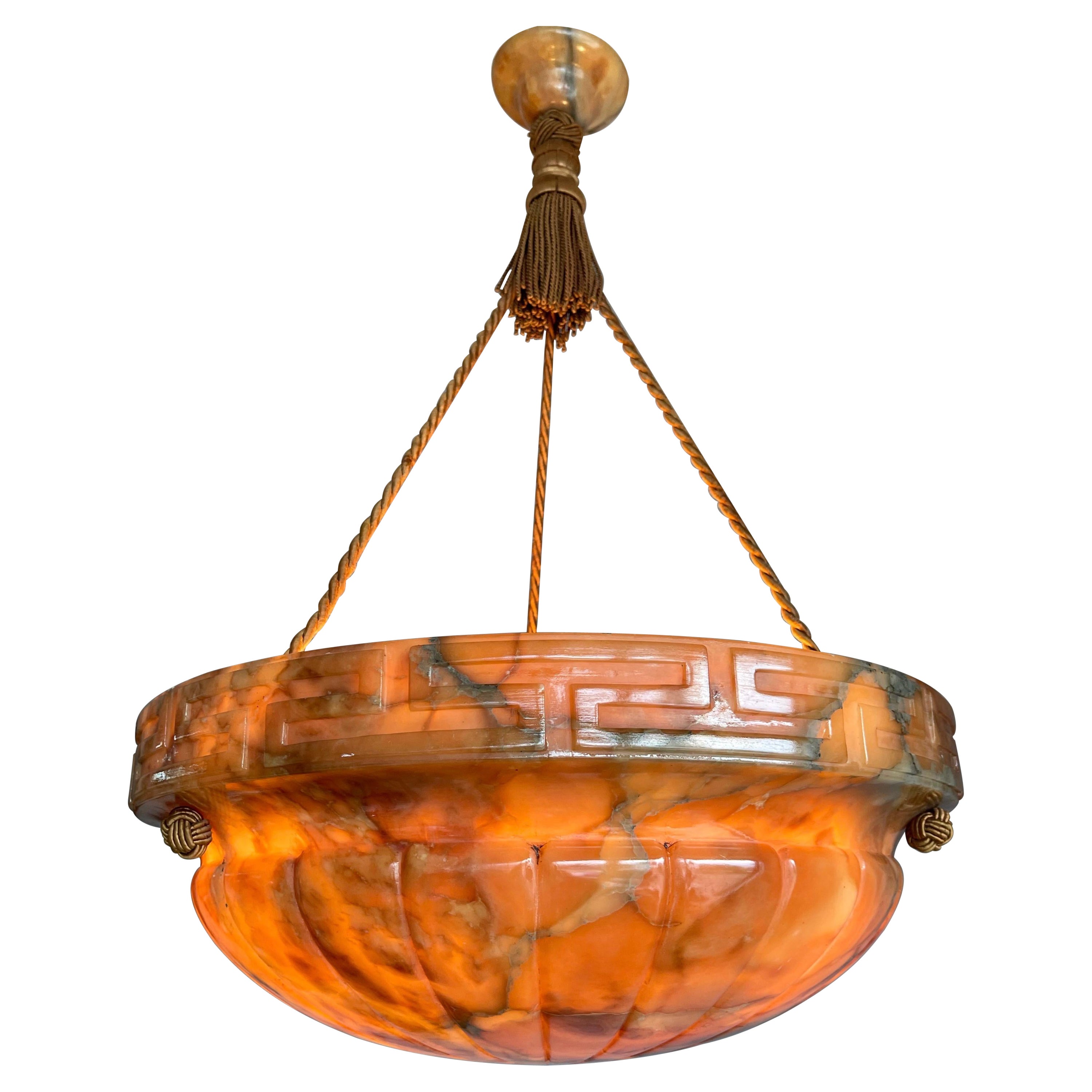 Beautiful design and wonderful light creating, mother nature mineral stone shade plaffonier ceiling light.

This marvelous and top quality carved, early 20th century alabaster pendant is hanging from the original alabaster canopy and perfectly