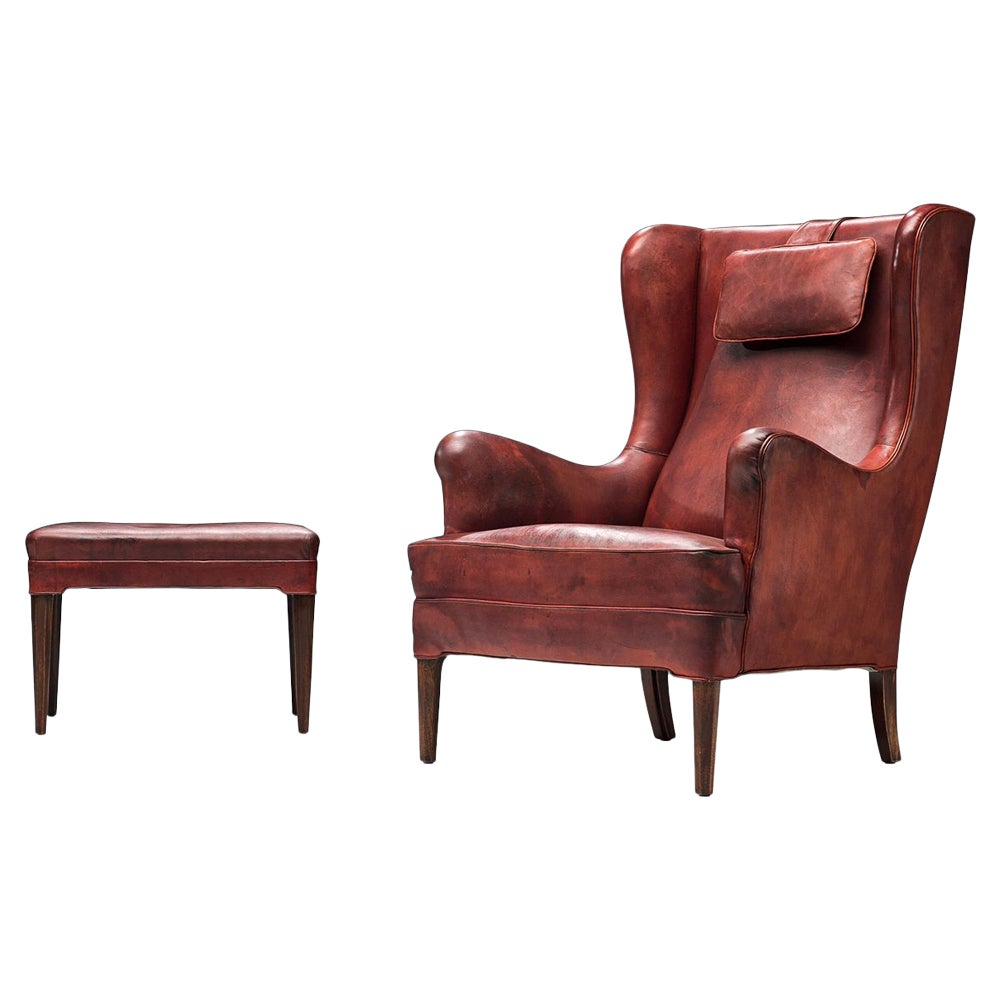 Frits Henningsen Lounge Chair with Ottoman in Original Burgundy Leather For Sale