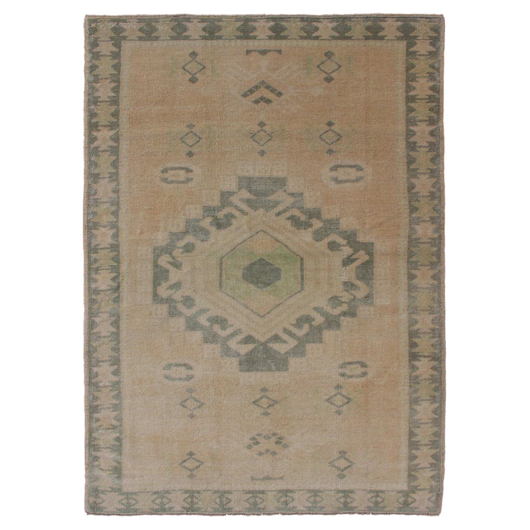 Vintage Oushak Rug with Central Medallion Warm Tones And Green Tones For Sale
