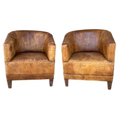 Pair Vintage European Leather Tub Chairs with Brass Nailhead Detail