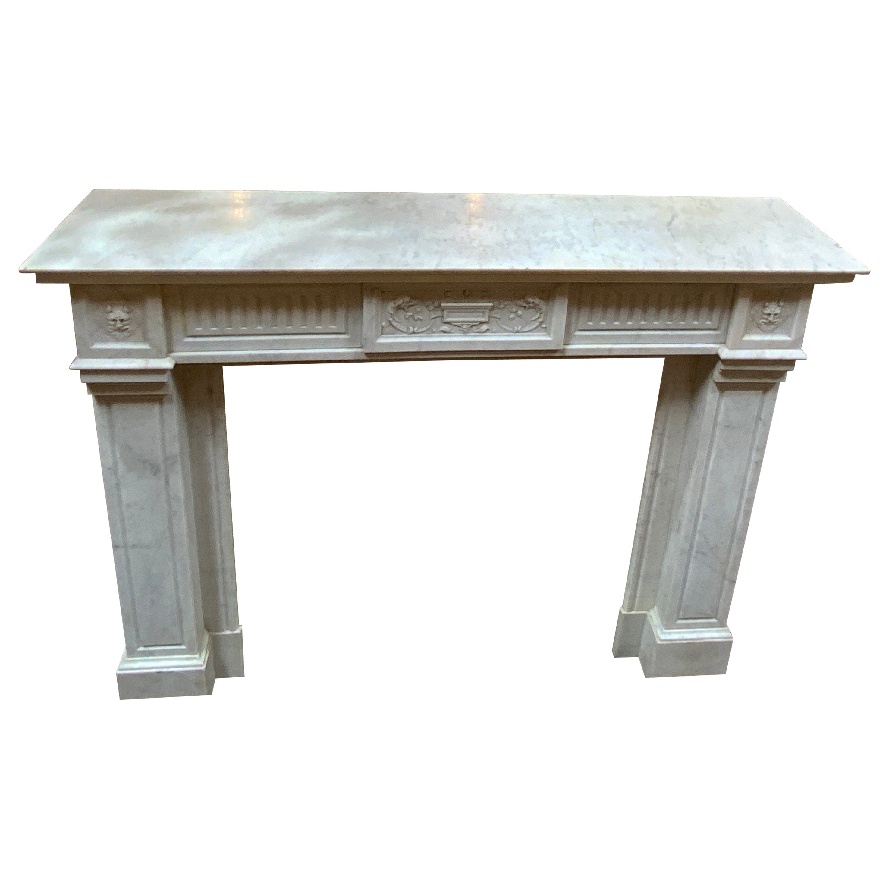 Louis XVI Marble Mantel with Fluting and Gargoyle Motif For Sale
