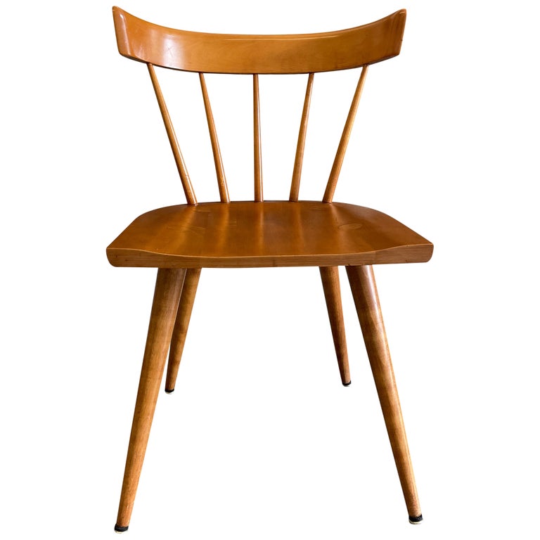 All original midcentury maple Paul McCobb Planner Group spindle back side chairs. Solid maple seat and curved back on tapered legs. Original vintage condition. Original blonde finish. These chairs are laeled Paul McCobb by Winchendon Furniture Co.