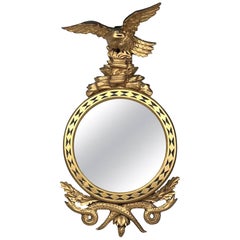 Miroir aigle-serpent en bois doré sculpté de style Régence